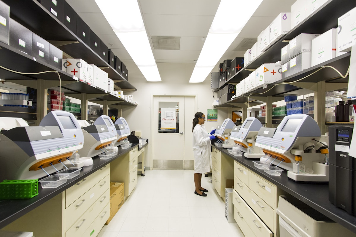 Researcher using a microscope